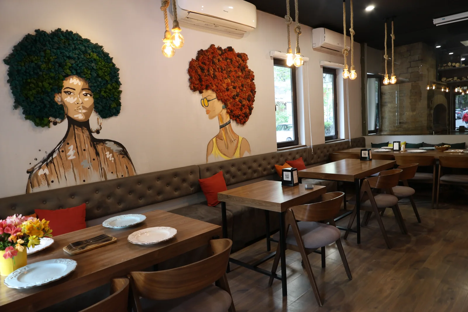 Andrew Kitchen & Bar — ambient dining room with curated lighting and intimate table settings